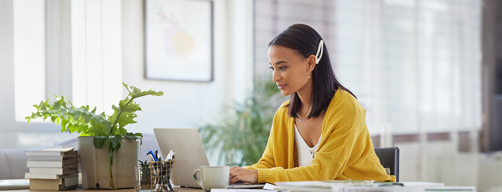 Learning and Development, Woman at table on laptop